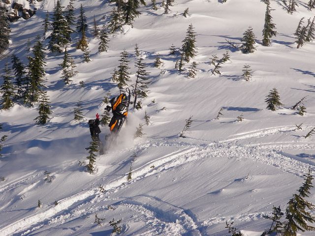My husband climbing President's Bowl, his sled went vertical and he fell straight down in the snow up to his neck!  Luckily the sled did not roll back.  Crazy Lucky Guy!!