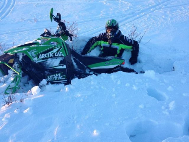 Snowmobiling and a friends farm about an hour south of weinright, hit a drift, got air, landed.. and sunk. 