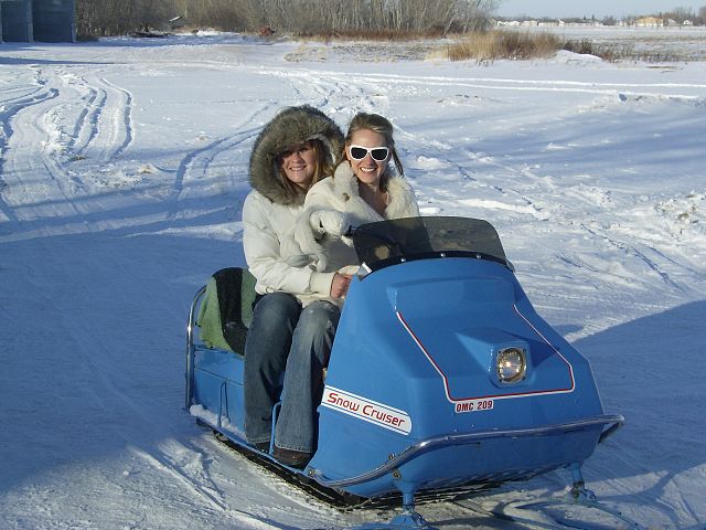 Babes on a vintage snowcruiser