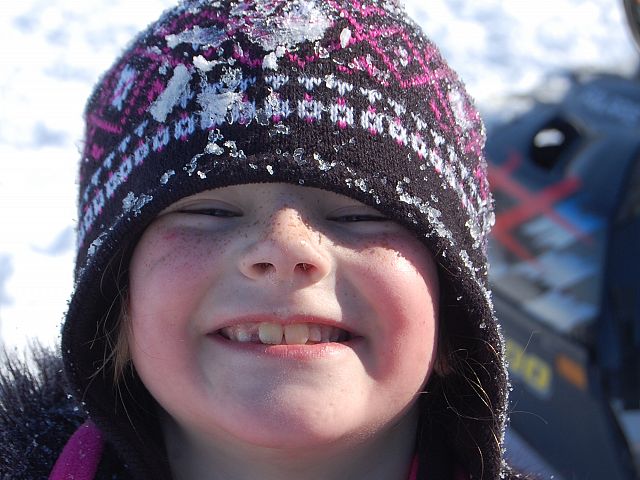 Tobogganing, a weiner roast, and riding with Nana and Papa on their snowmobiles make for a perfect winter day.