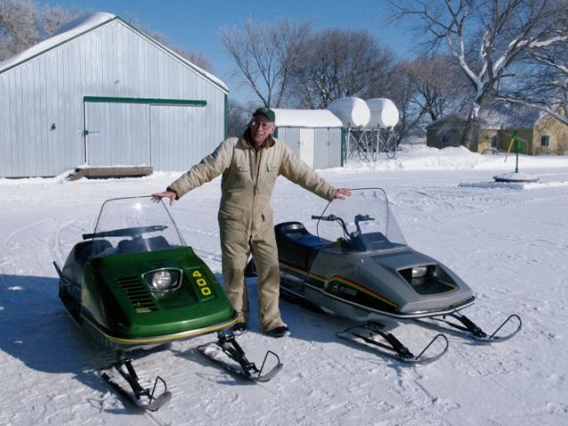 Standing between my 1975 John Deere 400 snowmobile and my 1982 John Deere Sportfire, both still running, both still in good condition.
