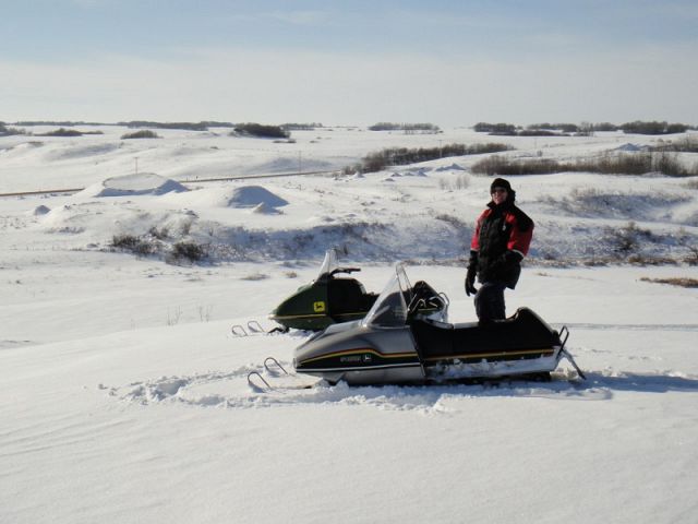 Exploring the Jumping Deere Creek Valley, located west of Lipton with my brother, Gary Wesa on our vintage John Deere snowmobiles.