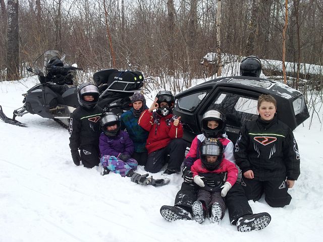 The kids enjoying a stop on the trail at Duck Mountain SK.