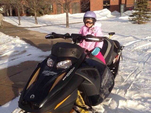 Mackenzie loves getting picked up from school on the sled. 