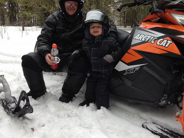 Grandpa and Grandson Ryder Kotelko having a great day snowmobiling