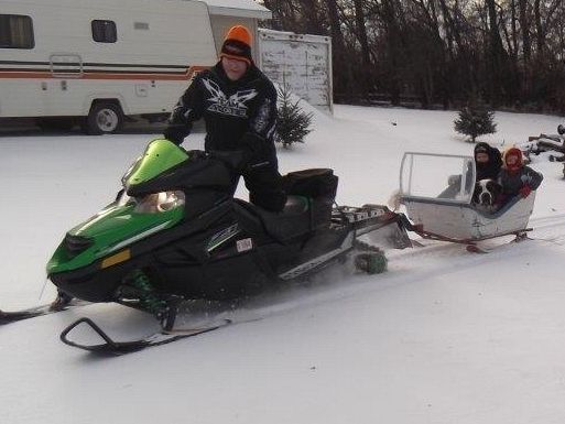 Grandkids and Kota getting a ride in the cutter!