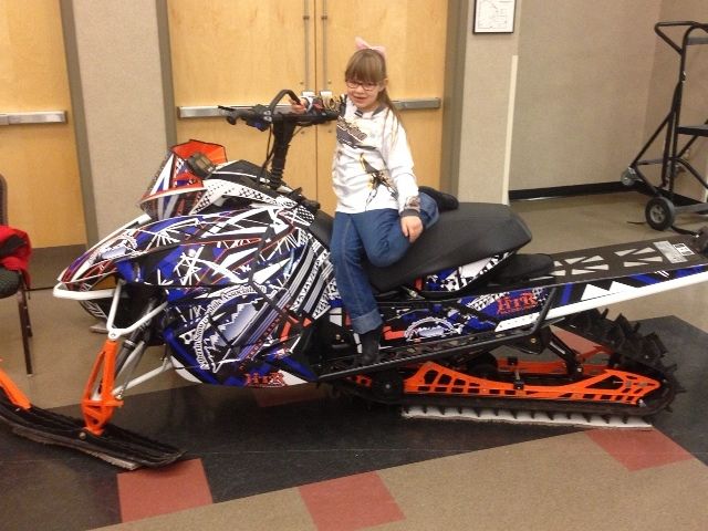 Olivia checking out the new ASA sled