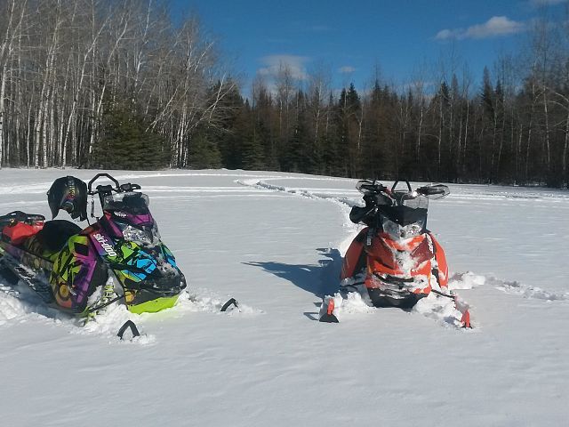Father and son enjoying the sun and snow