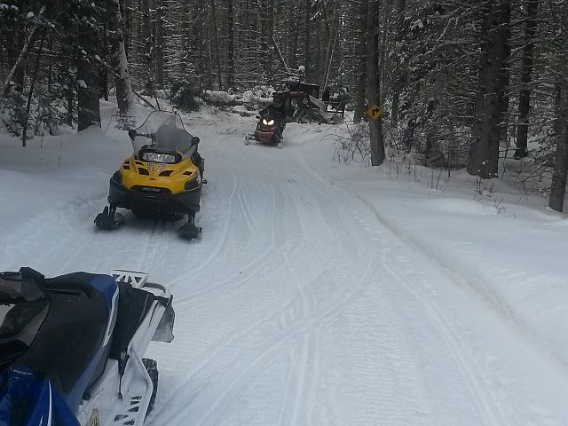 Workers widening the groomed trail