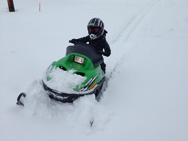 Bentley 3 years old driving his first sled