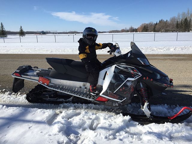 5 year old going for first ride on the new sled