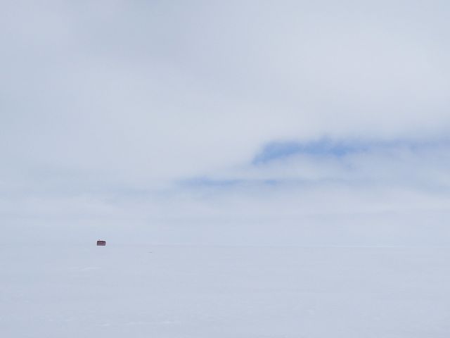 Blowing snow makes it hard to see far on the lake.