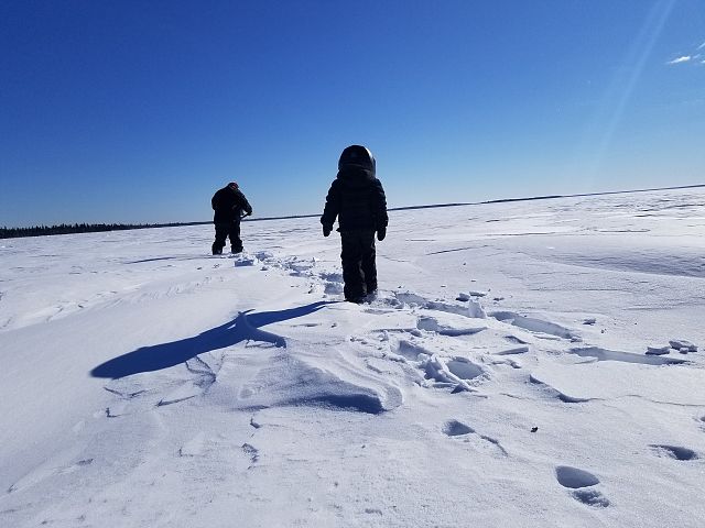 Kid wore his ski-doo helmet ALL day! Good way to keep warm.