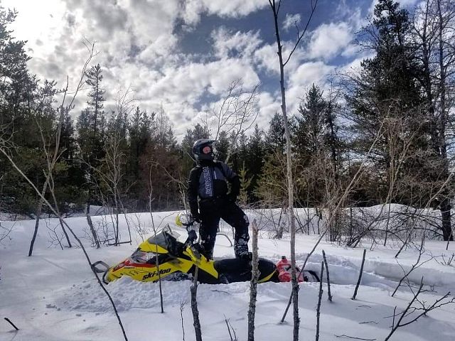 On top of the sled , but not the snow !! 