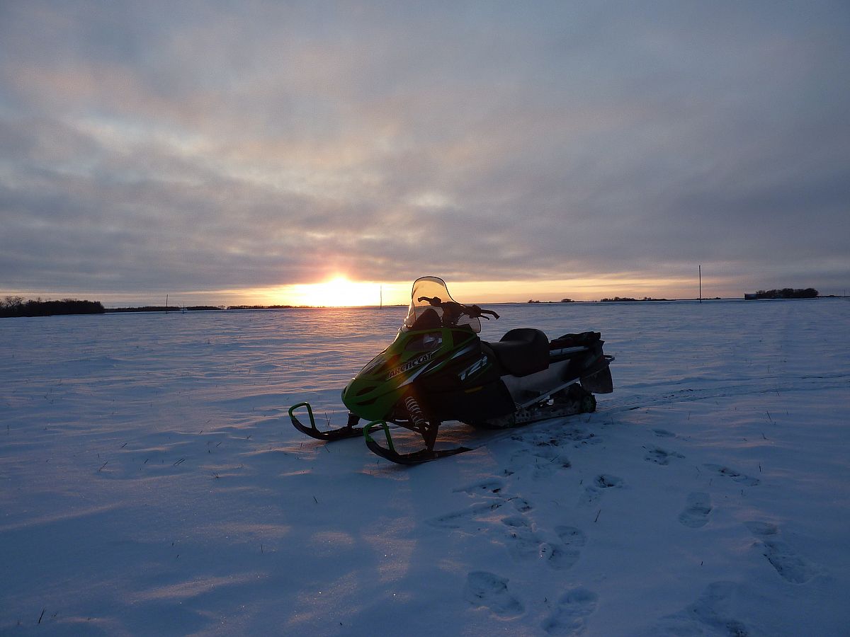 Sunset on the "Arctic" cat...headed back to Beausejour from sledding with a buddy in PInawa.