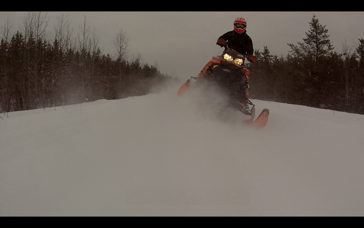 snapshot from GoPro mounted to back bumper of buddies sled looking back at me