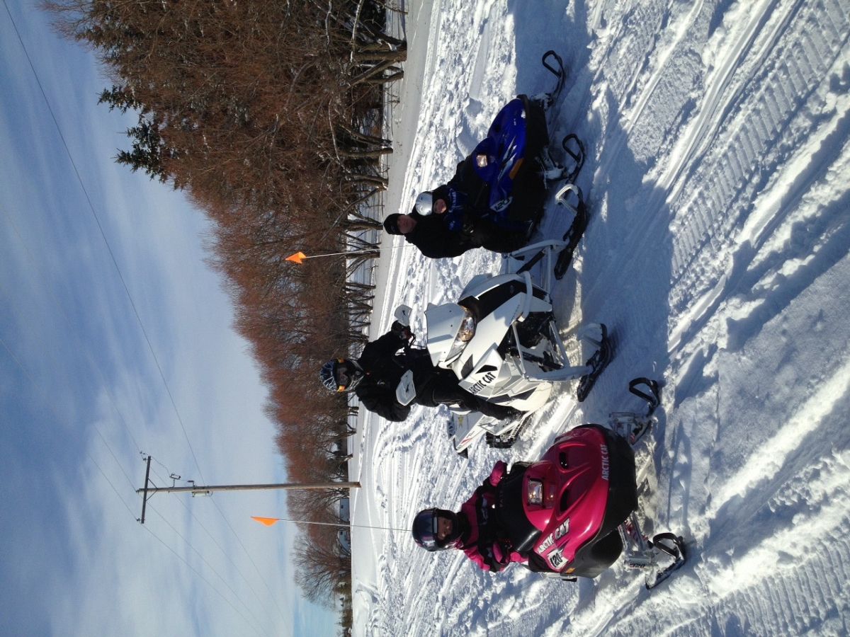 Nice saskatchewan day with two lil snowmobilers!