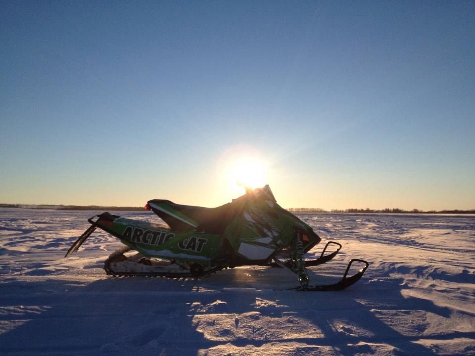 This is my 2013 Snopro 500 that i got for Christmas(BEST PRESENT EVER!!!) and we had a nasty wind that created drifts and thought it would be a good picture against the sun.