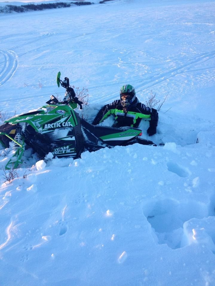 Snowmobiling and a friends farm about an hour south of weinright, hit a drift, got air, landed.. and sunk. 