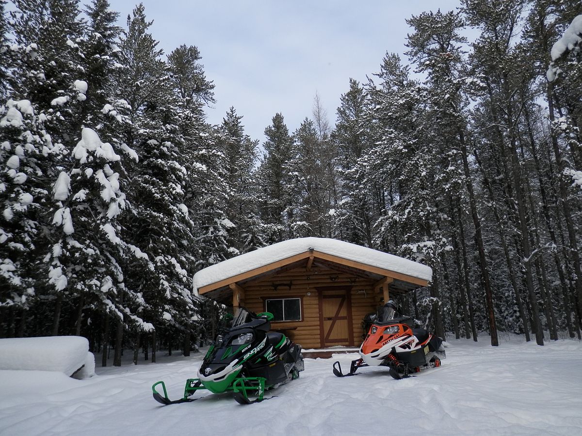 Log cabin snowmobile club shelter