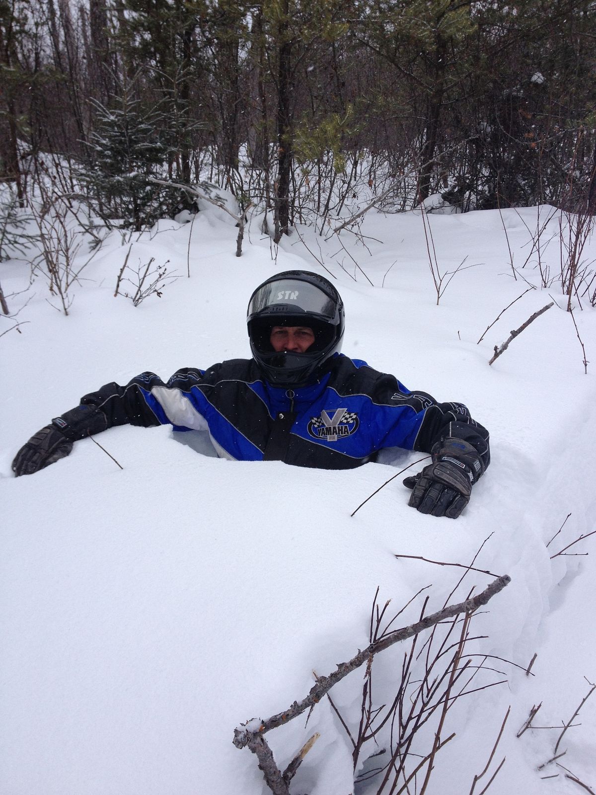 Okay, it's not a snowmobile getting stuck, but instead my husband showing us how deep the snow was.  (he's 5'9")