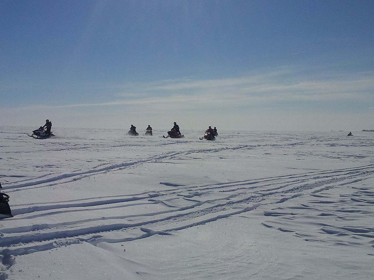 Another group of sledders having fun north of Indian Head SK-Typical Canola Field Scene in Saskatchewan!