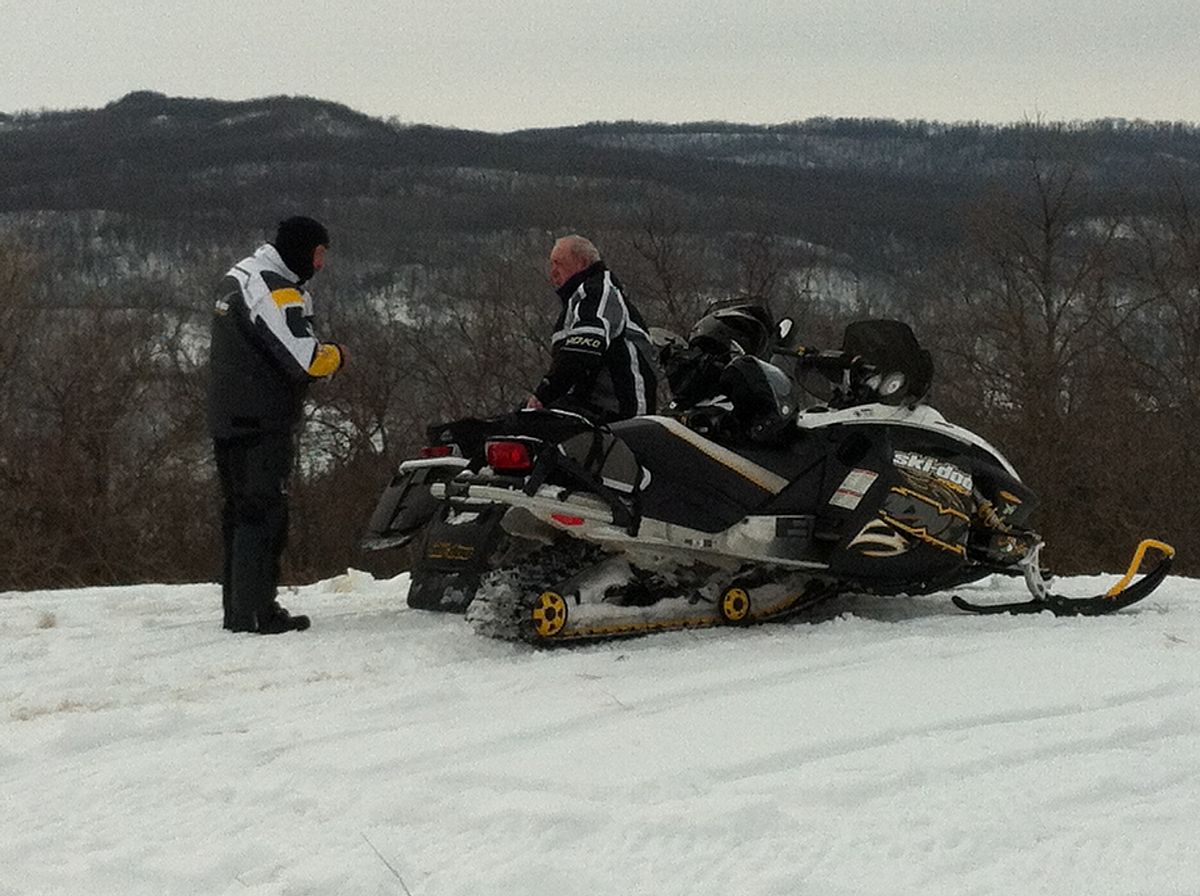 Bernie Twardowski and Johnny McRae stopped for a quick picture over the tops of the Pembina Hills.  Ski doo and Cat needed a rest while the Assault was tearing up the trails, lol.