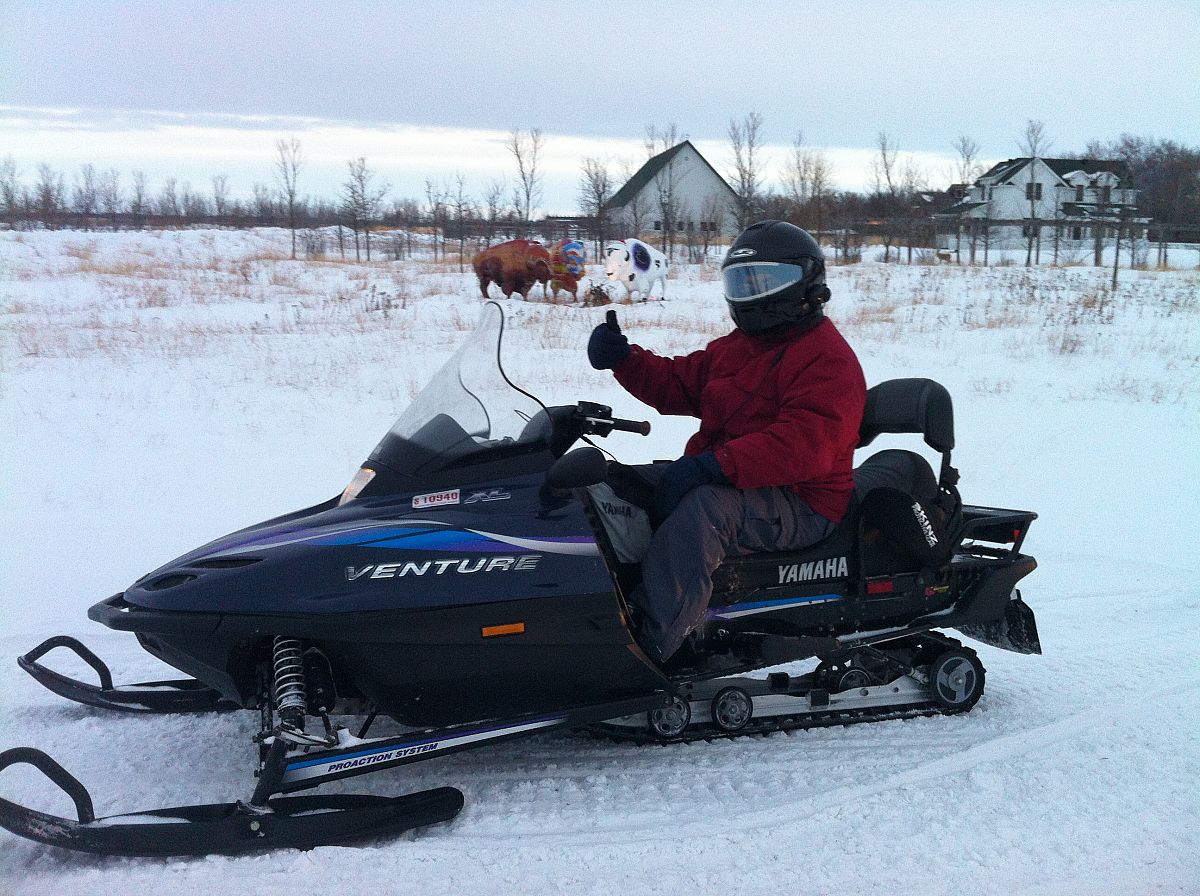 Mike on his first trip to North Dakota and enjoying his first snowmobile ride.