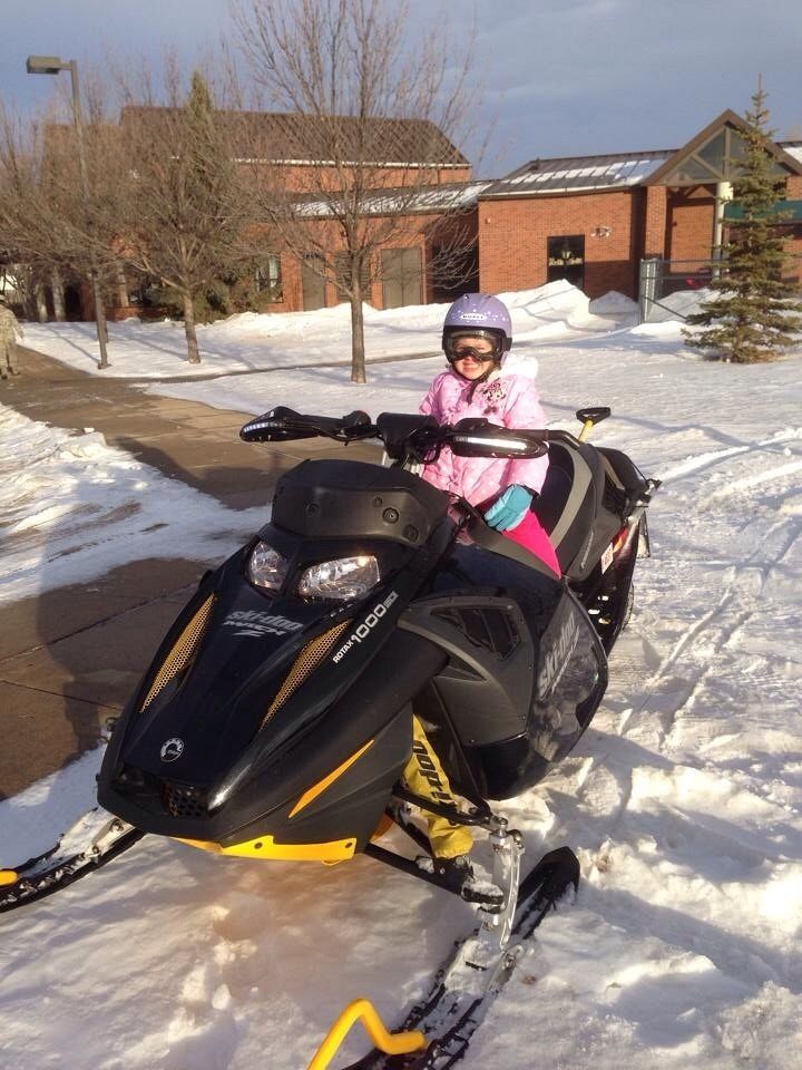 Mackenzie loves getting picked up from school on the sled. 