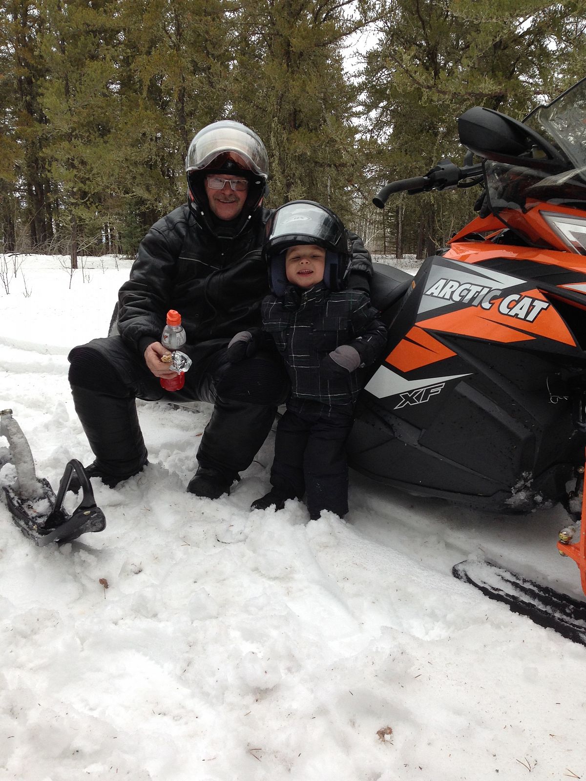 Grandpa and Grandson Ryder Kotelko having a great day snowmobiling