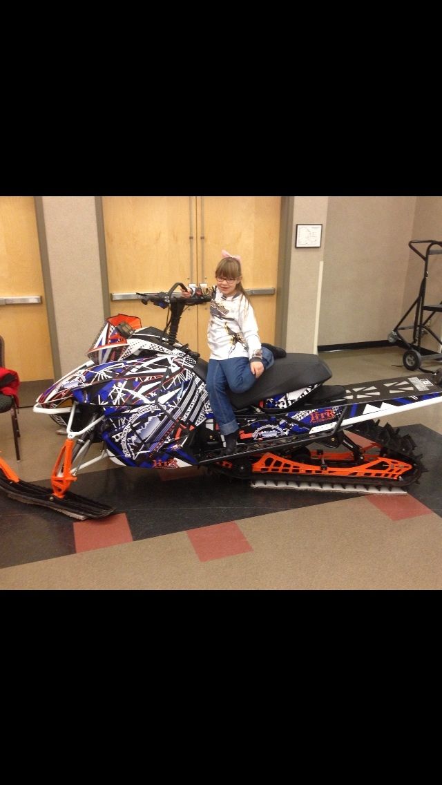 Olivia checking out the new ASA sled