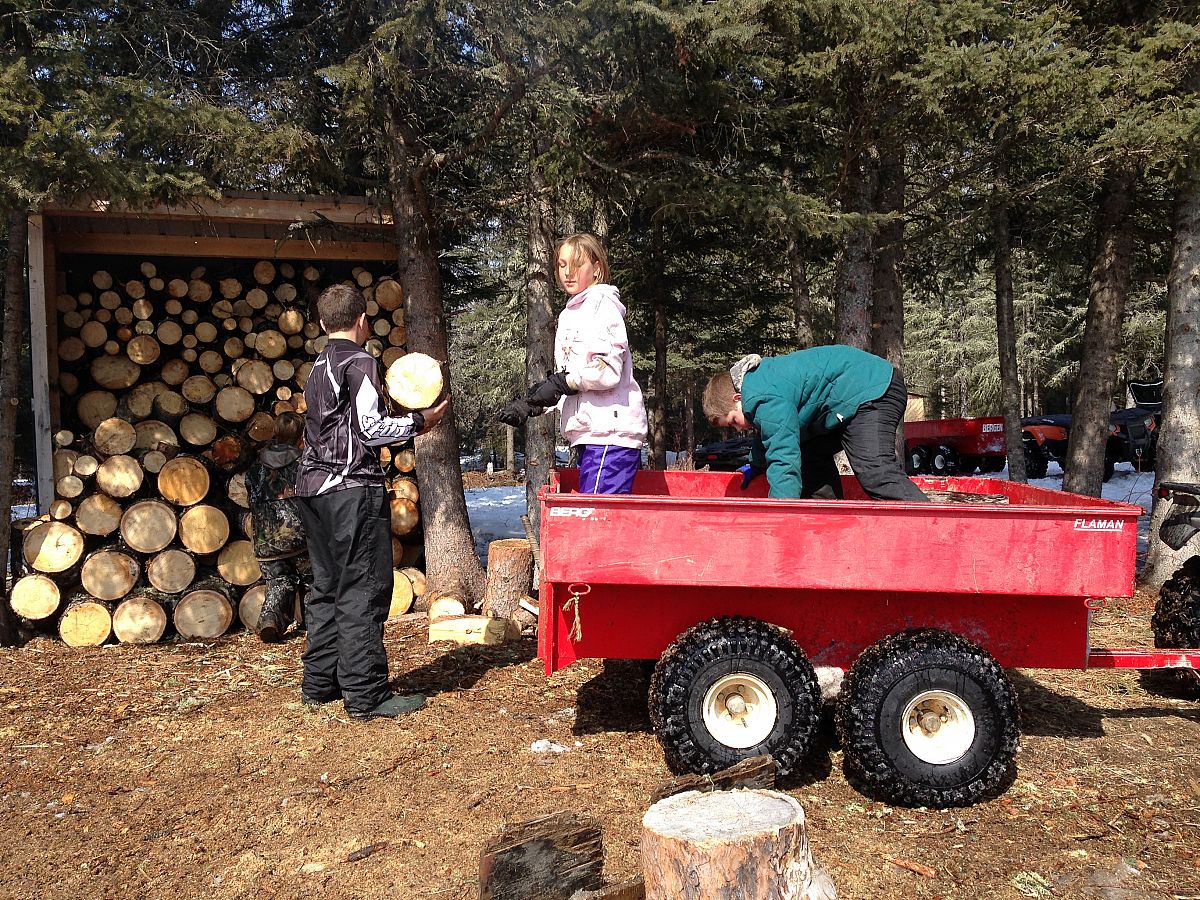 Wood cutting work bee and the kids of our club unloading the trailer and stocking the wood bin